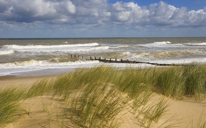 Beach with dunes and waves