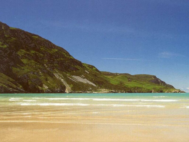 beach with green hills