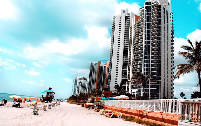 Beach with High-rise Buildings — Blue, Sunny