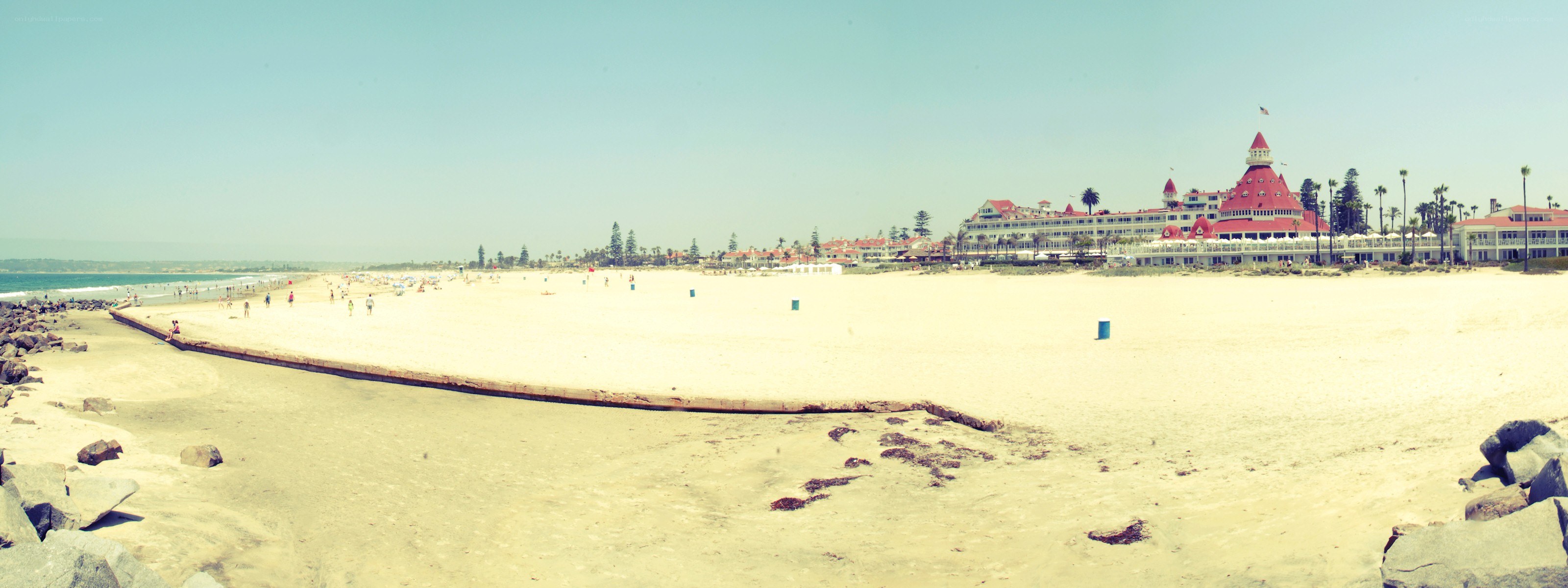 beach with hotel in the background