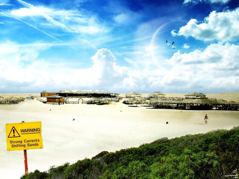 Beach with Huts and Sign