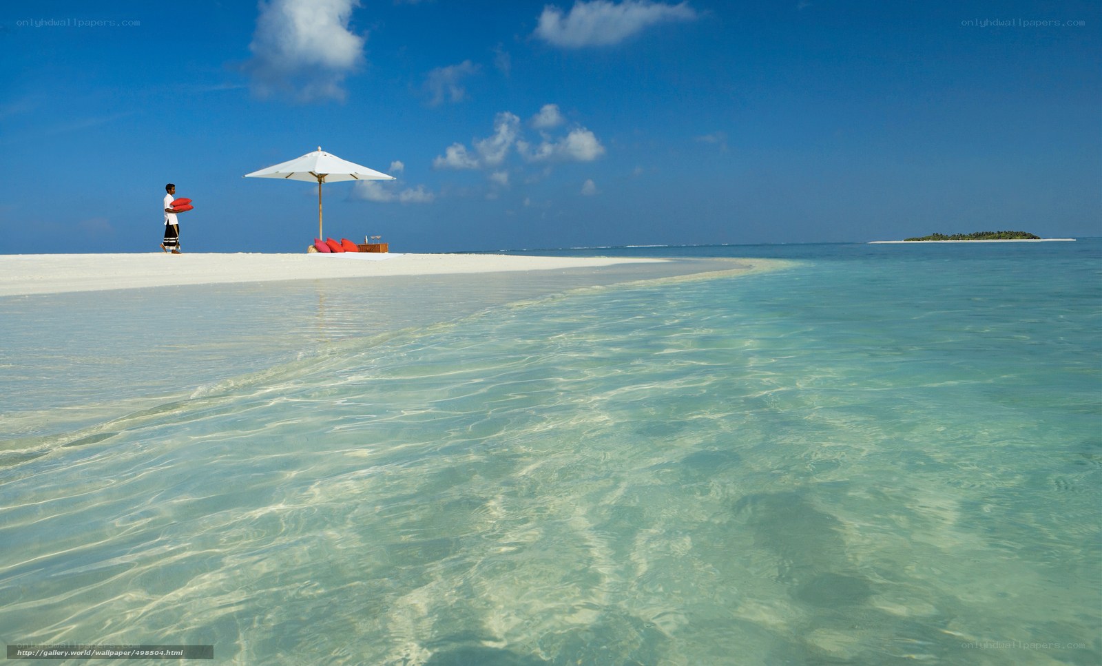 Beach with lounge chair and umbrella