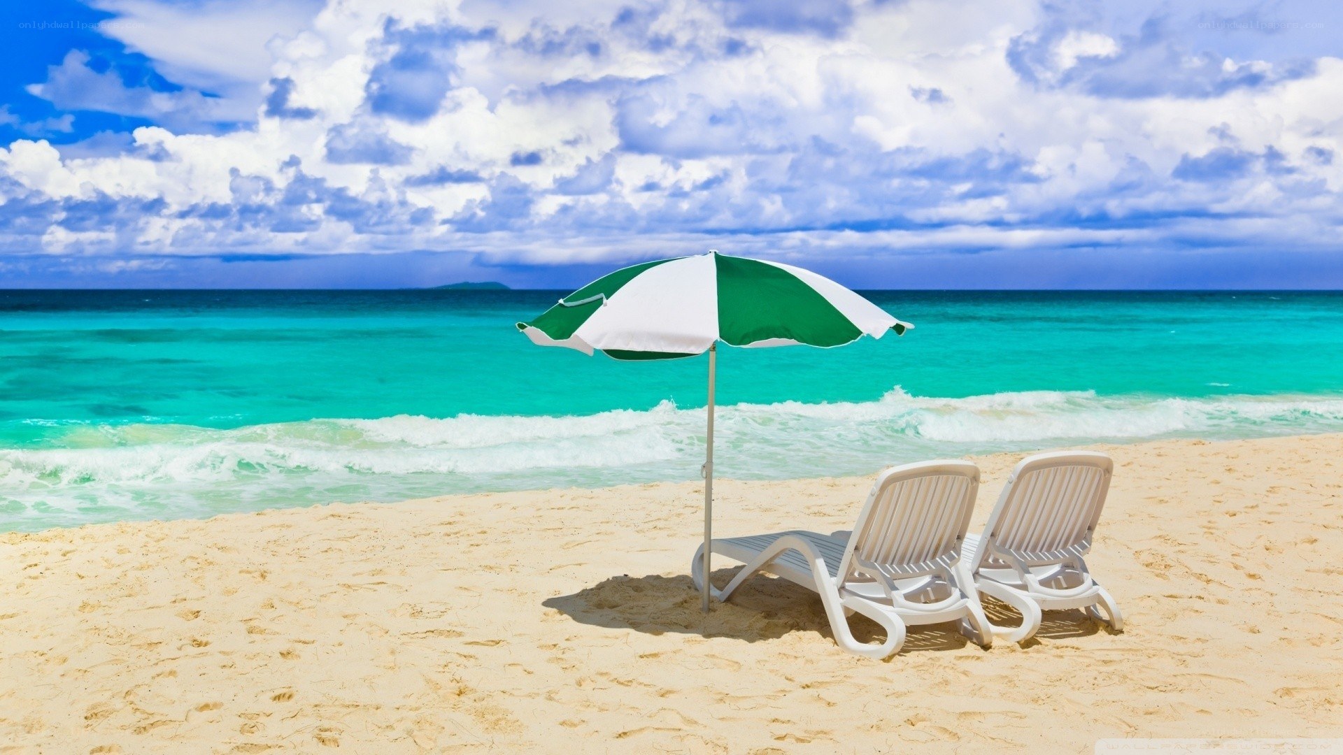 Beach with lounge chairs