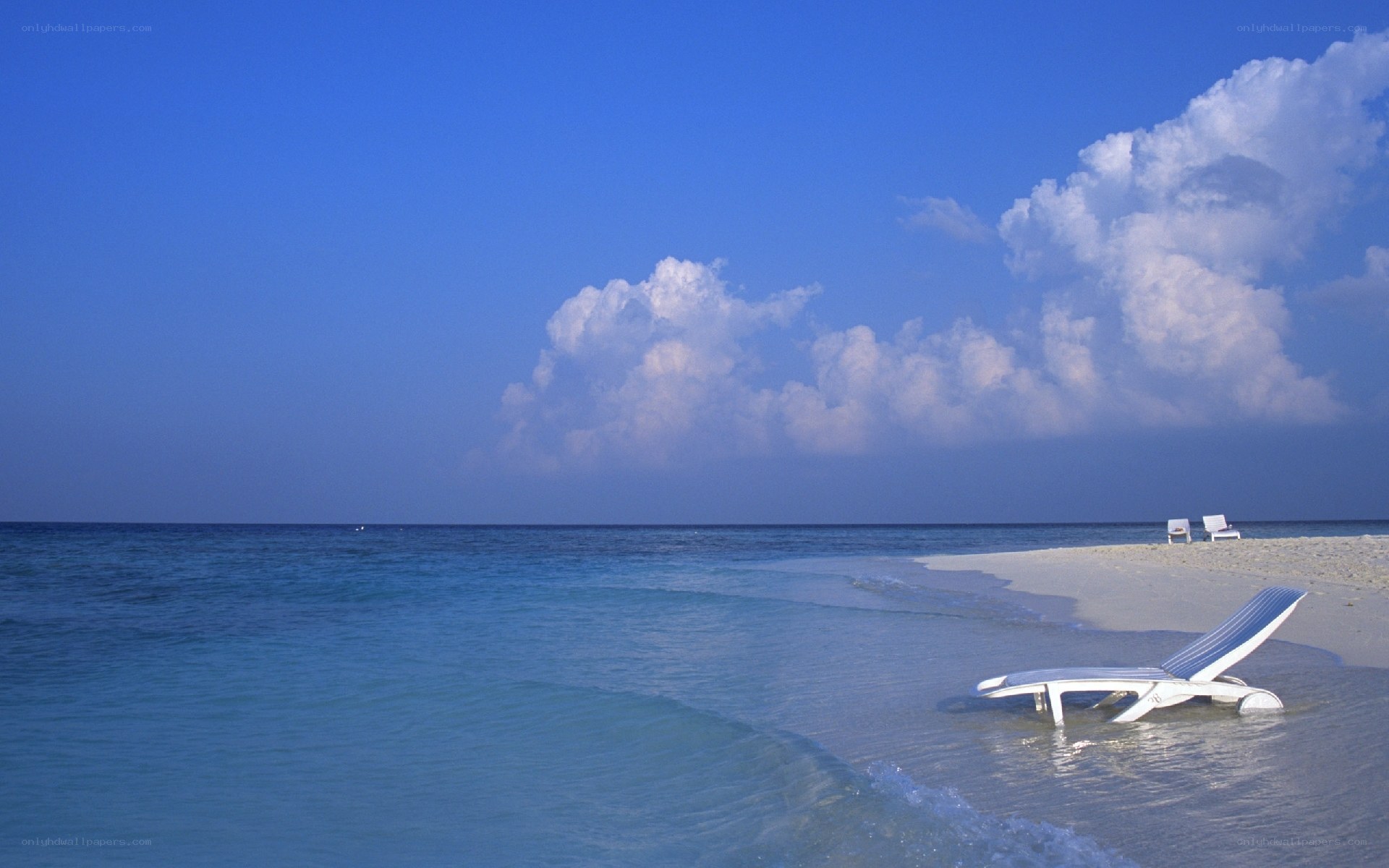Beach with lounge chairs