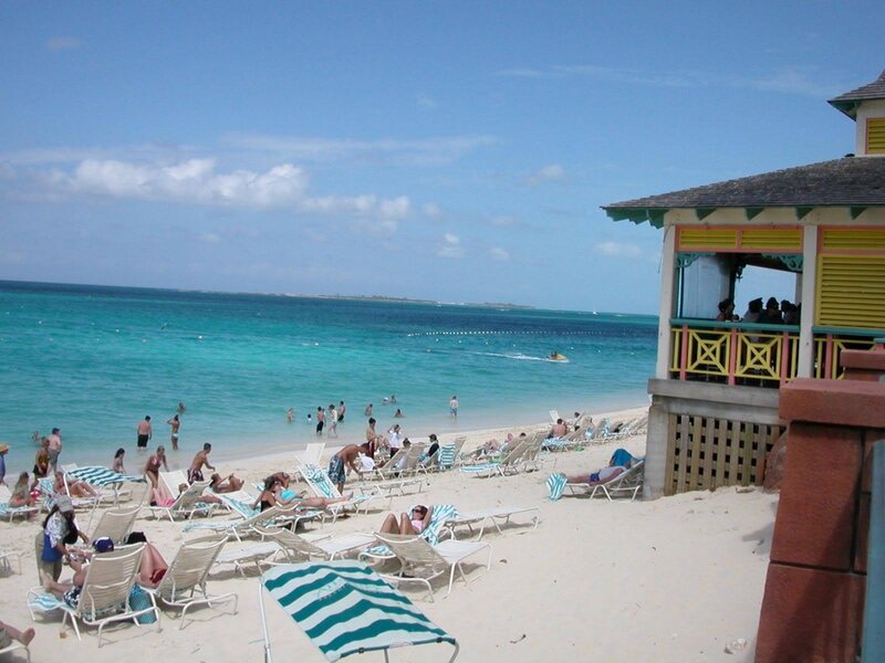 Beach with lounge chairs and ocean
