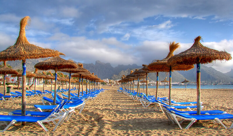 Beach with lounge chairs and umbrellas