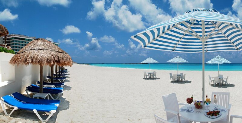 Beach with lounge chairs and umbrellas