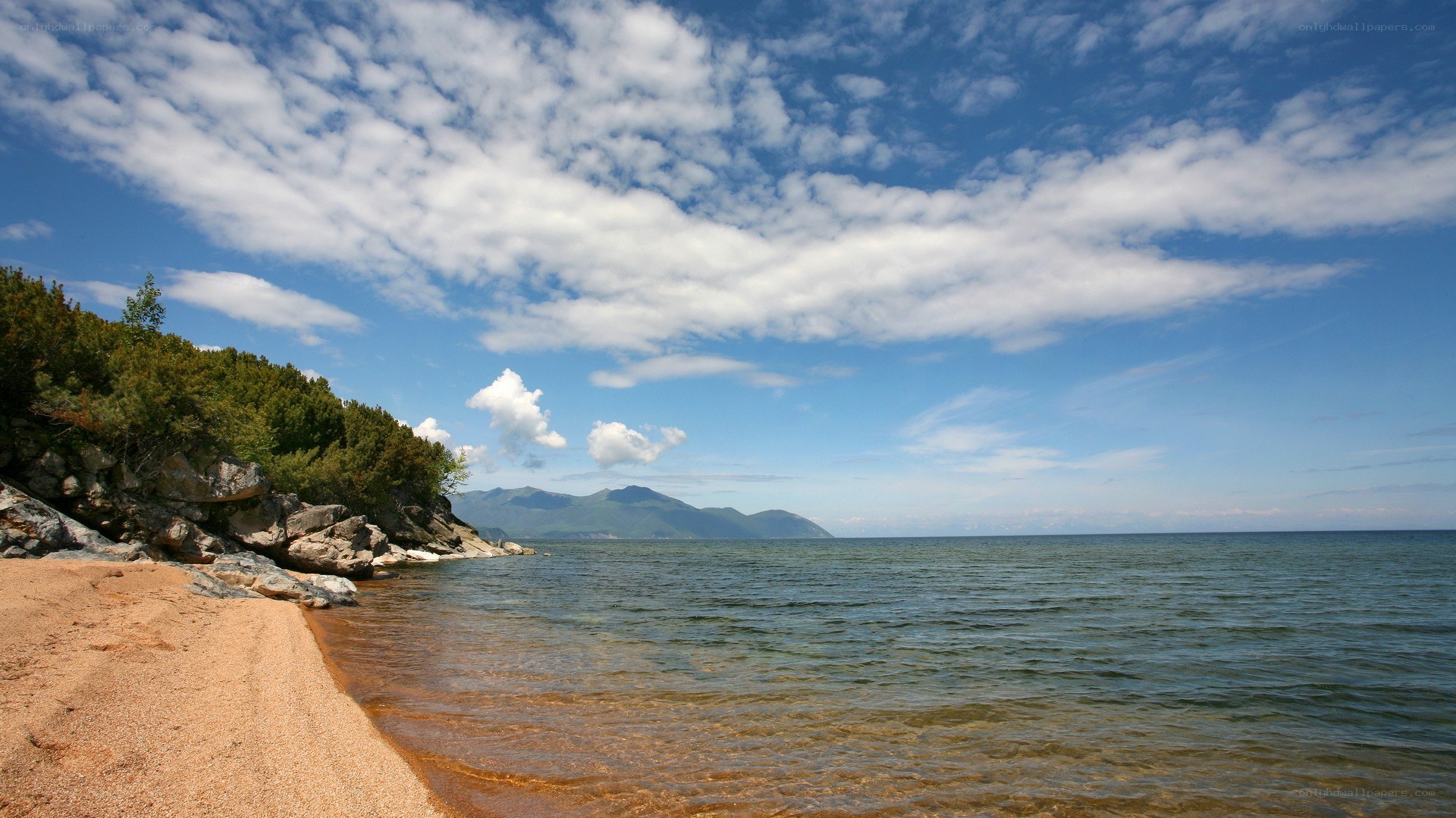 Beach with mountains in background