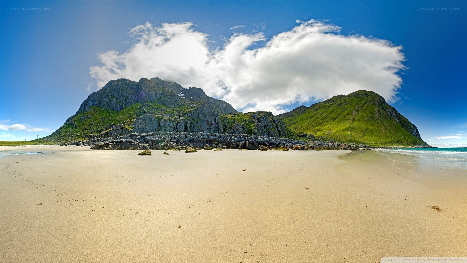 beach with mountains in background
