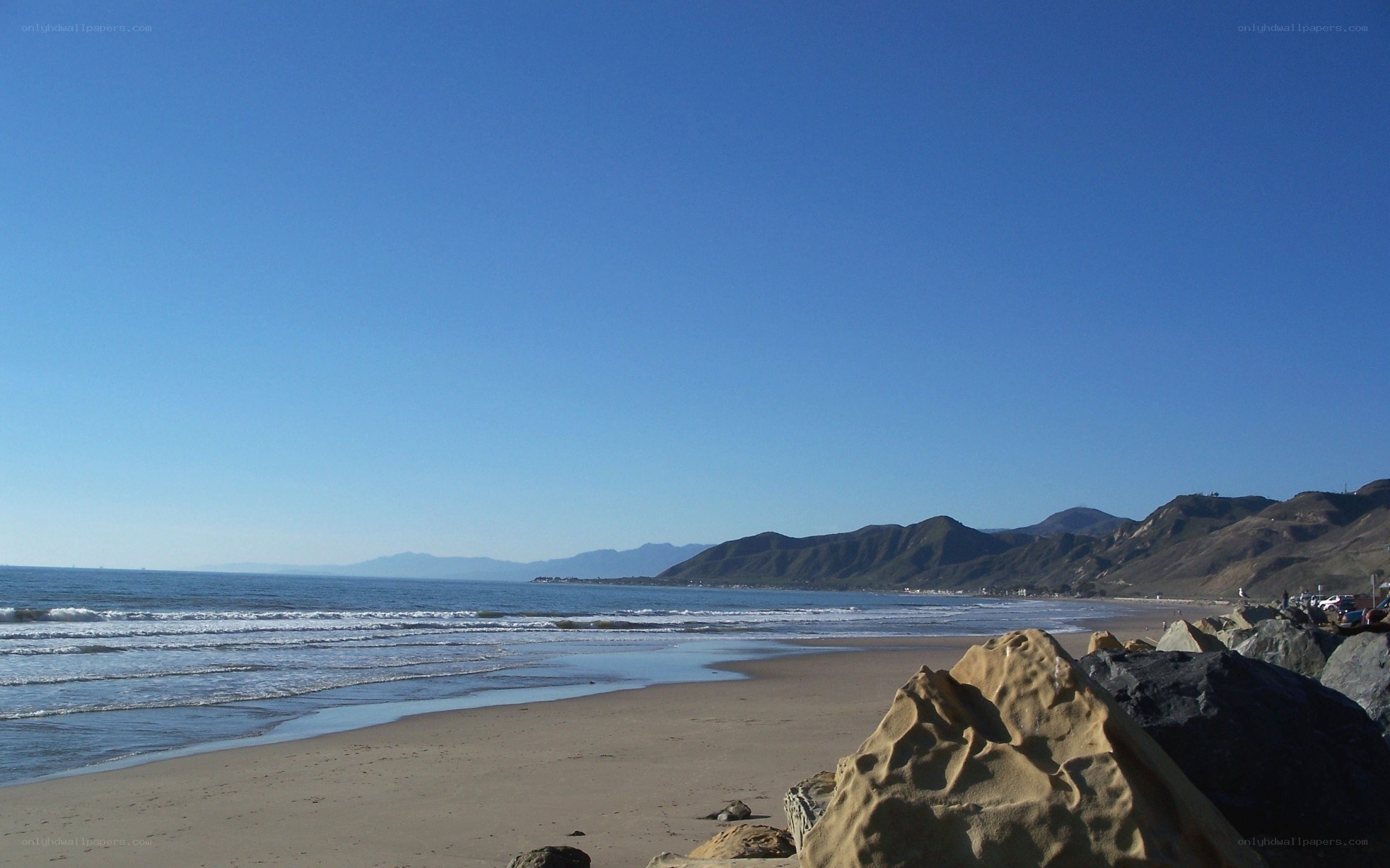 beach with mountains in background