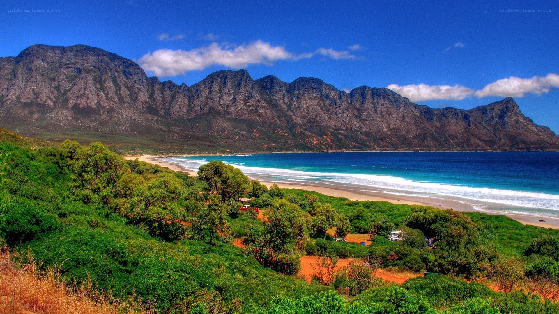 beach with mountains in background