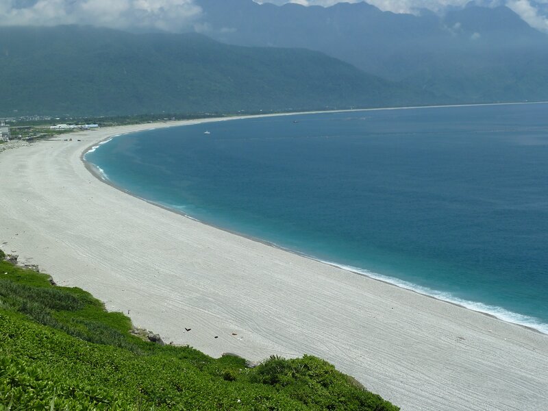 beach with mountains in background