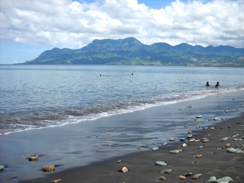 beach with mountains in background