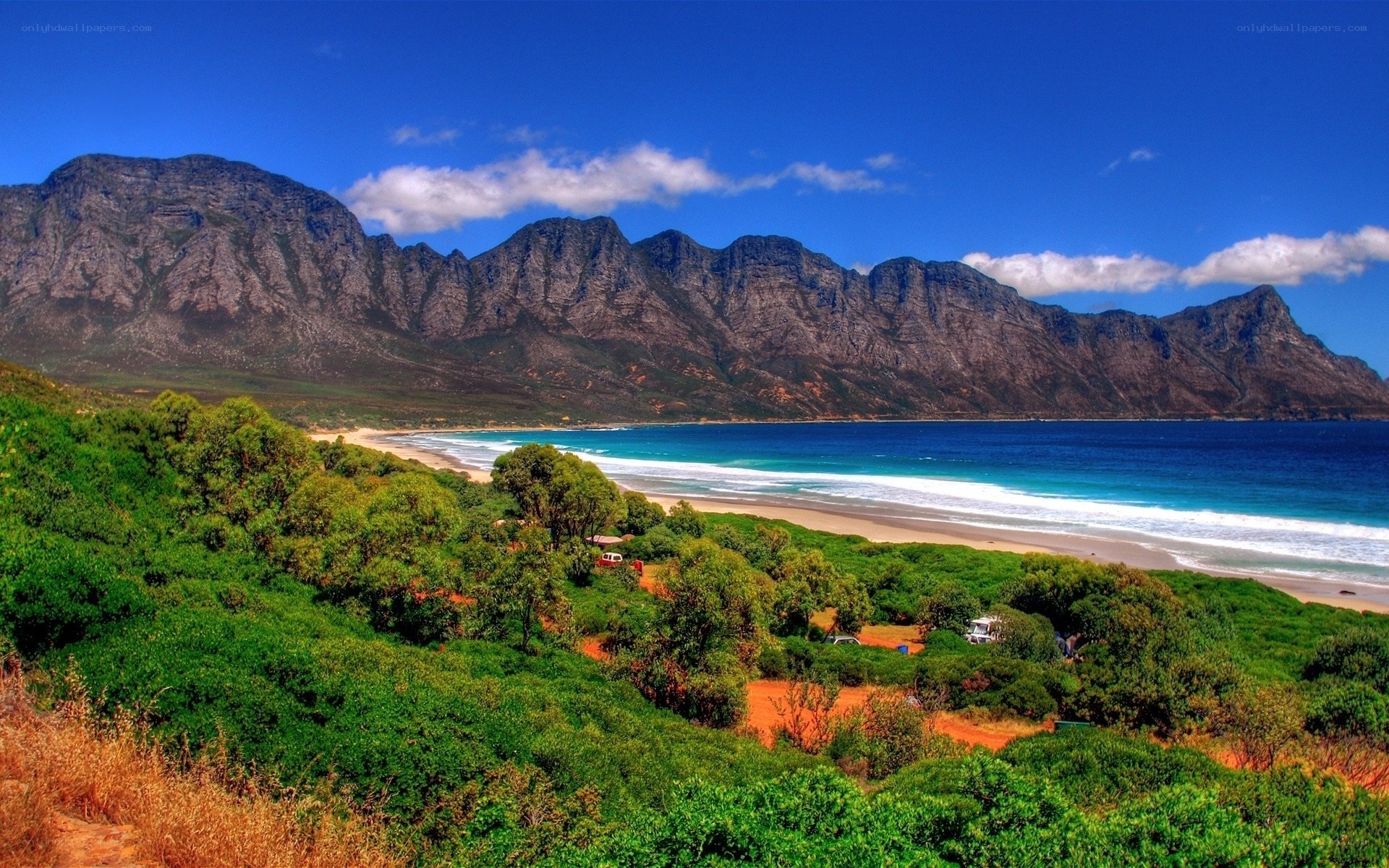 beach with mountains in background