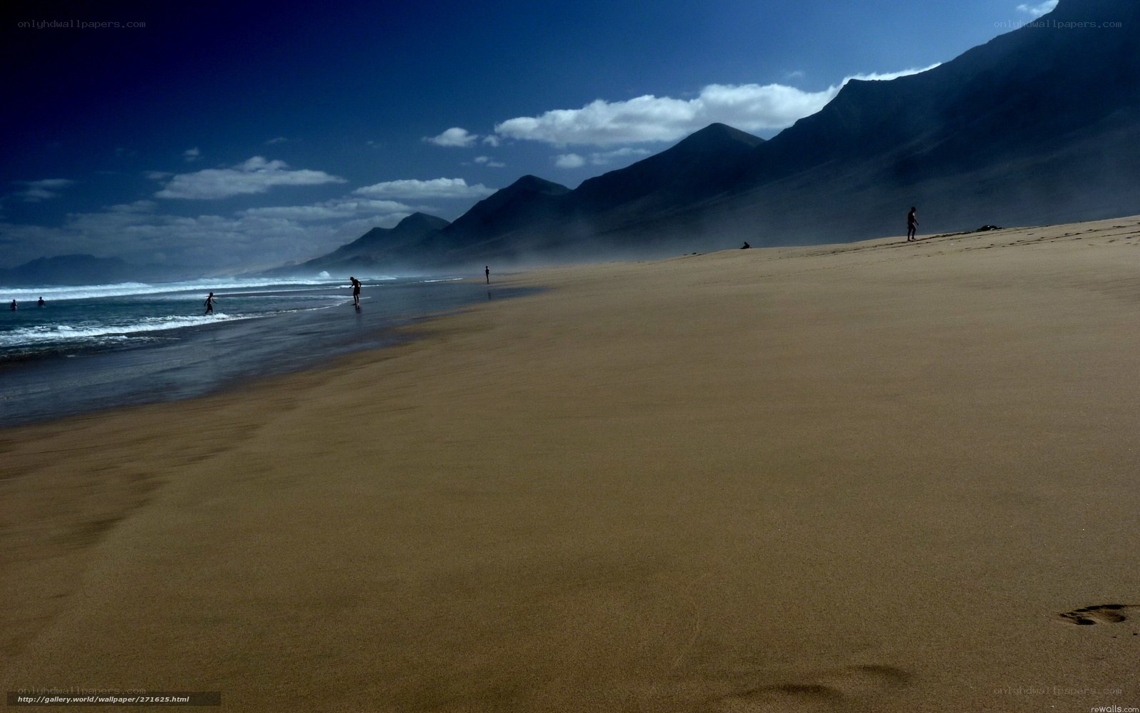 Beach with mountains in background
