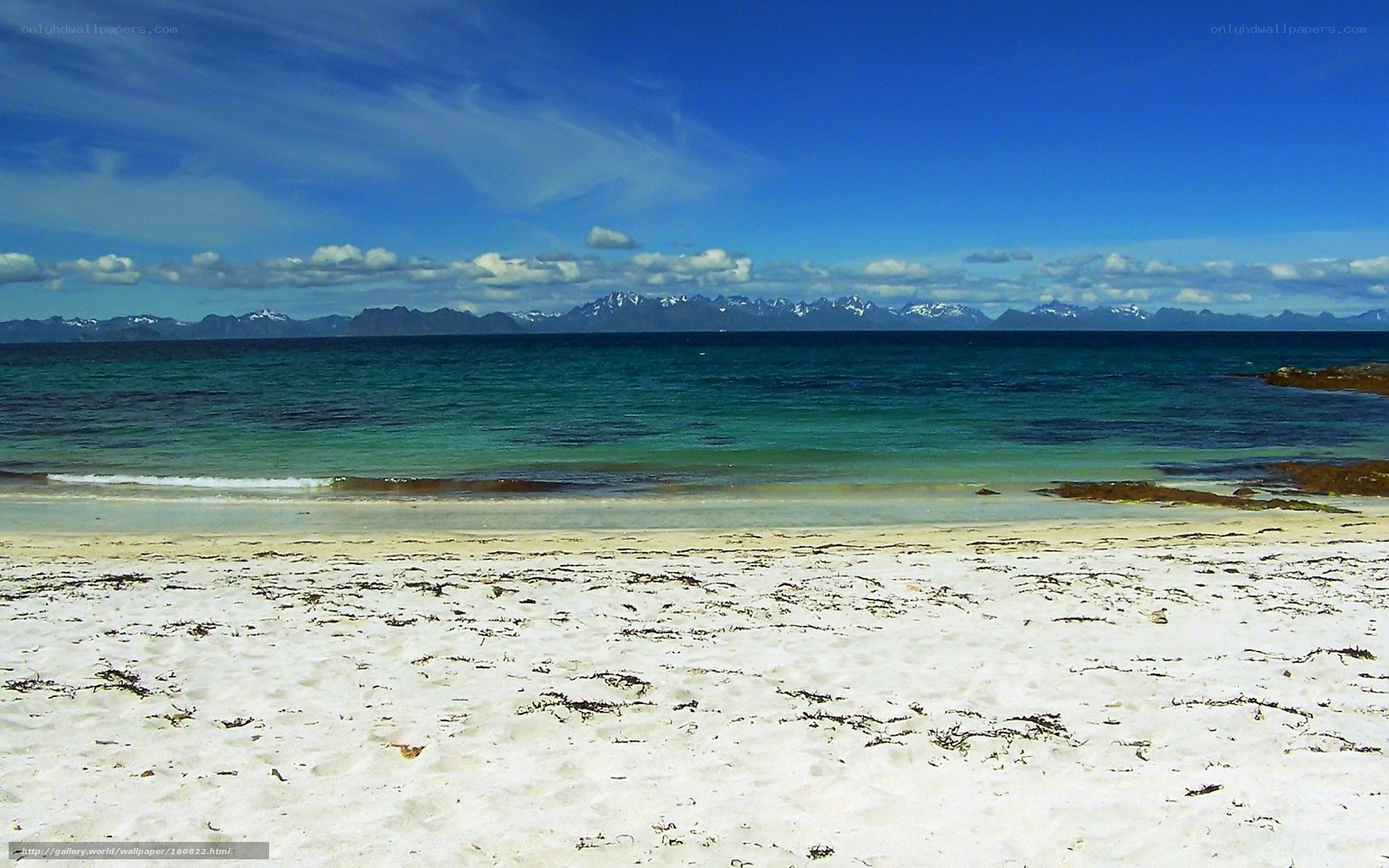 beach with mountains in distance