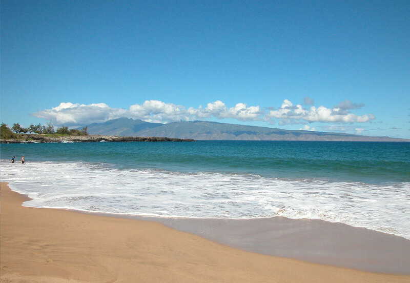 beach with ocean and mountains
