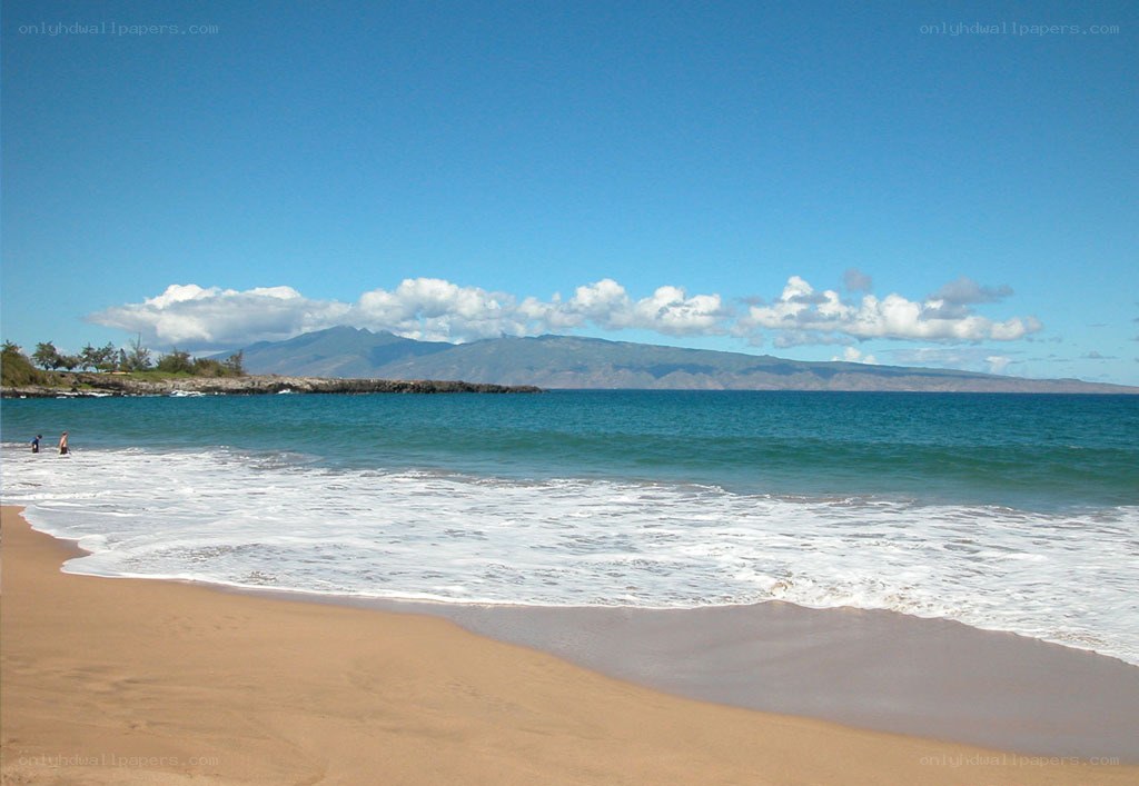 beach with ocean and mountains