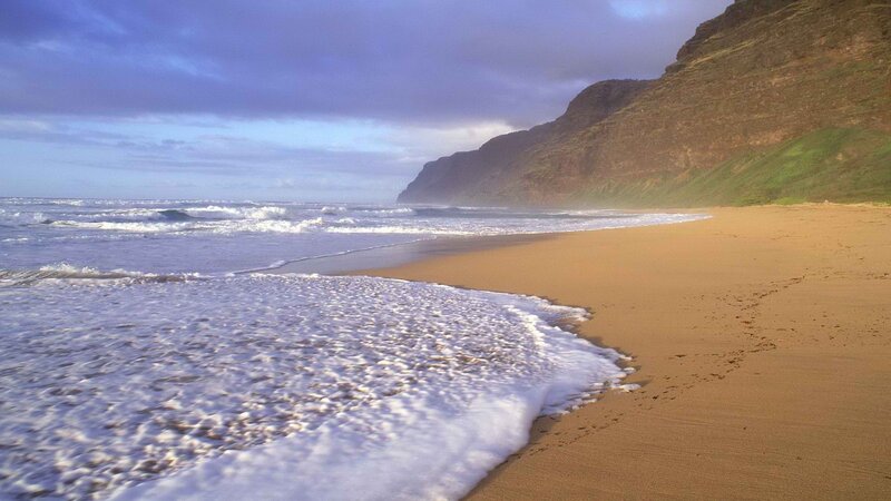 beach with ocean waves and cliffs