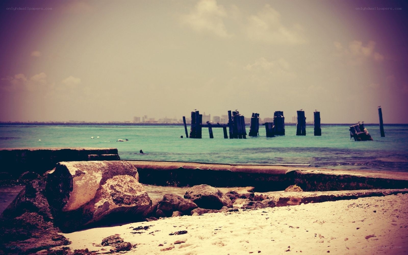Beach with old pier ruins