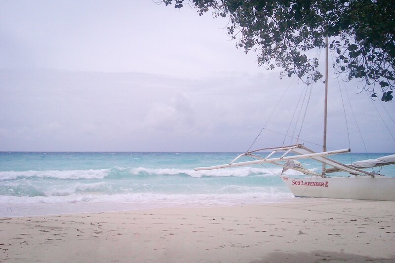 Beach with outrigger boat