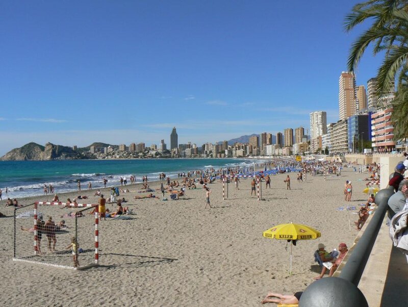 Beach with People and City