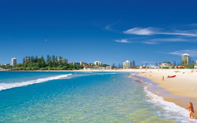 Beach with People — Blue, Serene, Afternoon, Photograph, Buildings