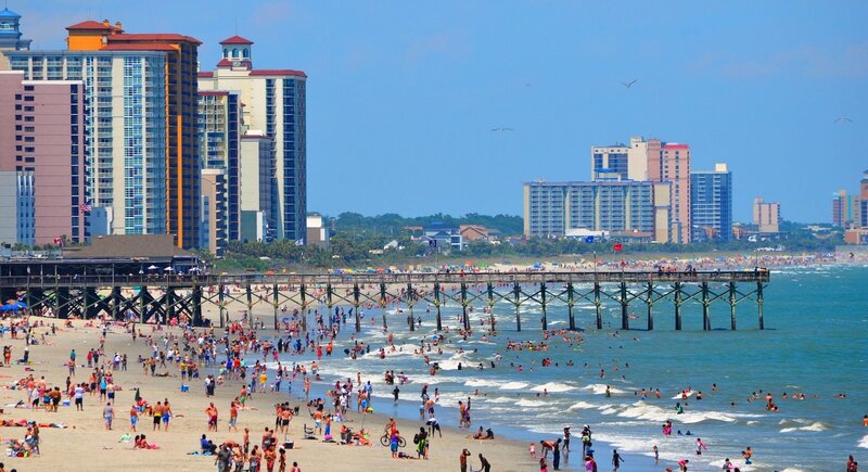 Beach with Pier and Buildings — Blue