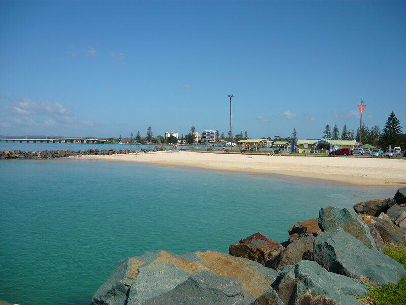 Beach with Pier and Buildings