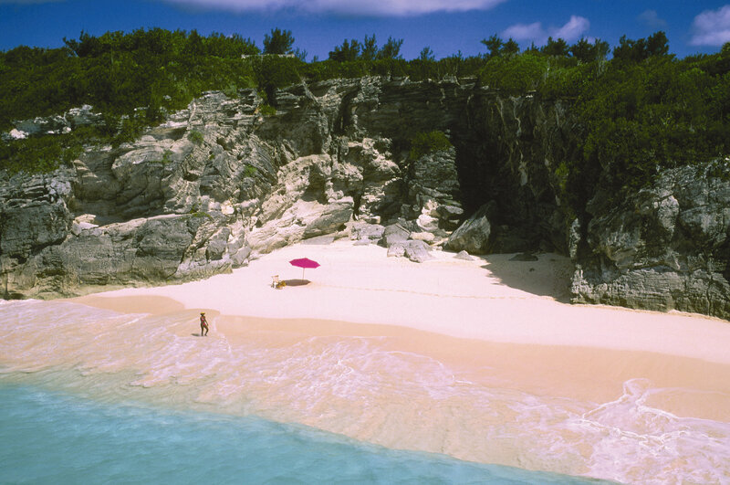 beach with pink umbrella