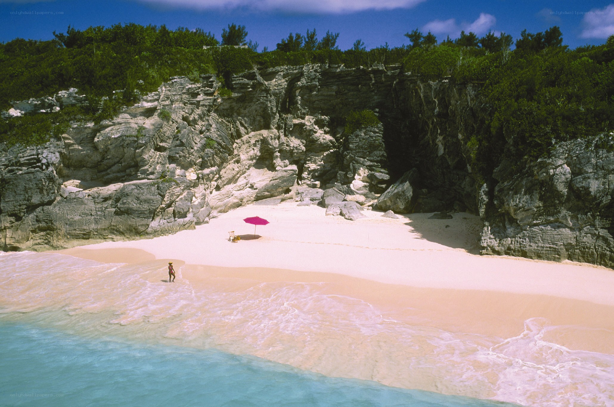 beach with pink umbrella