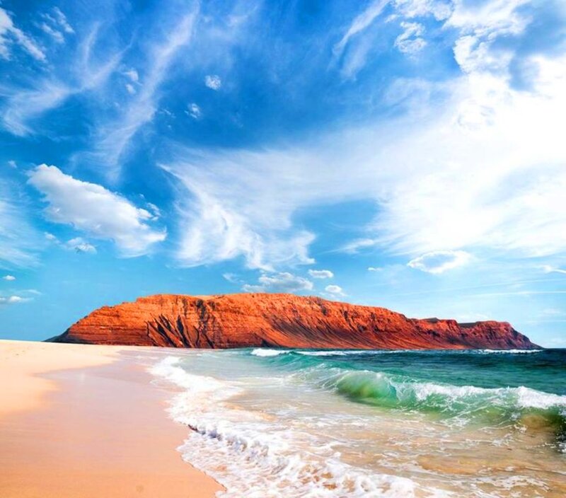 Beach with Red Cliff