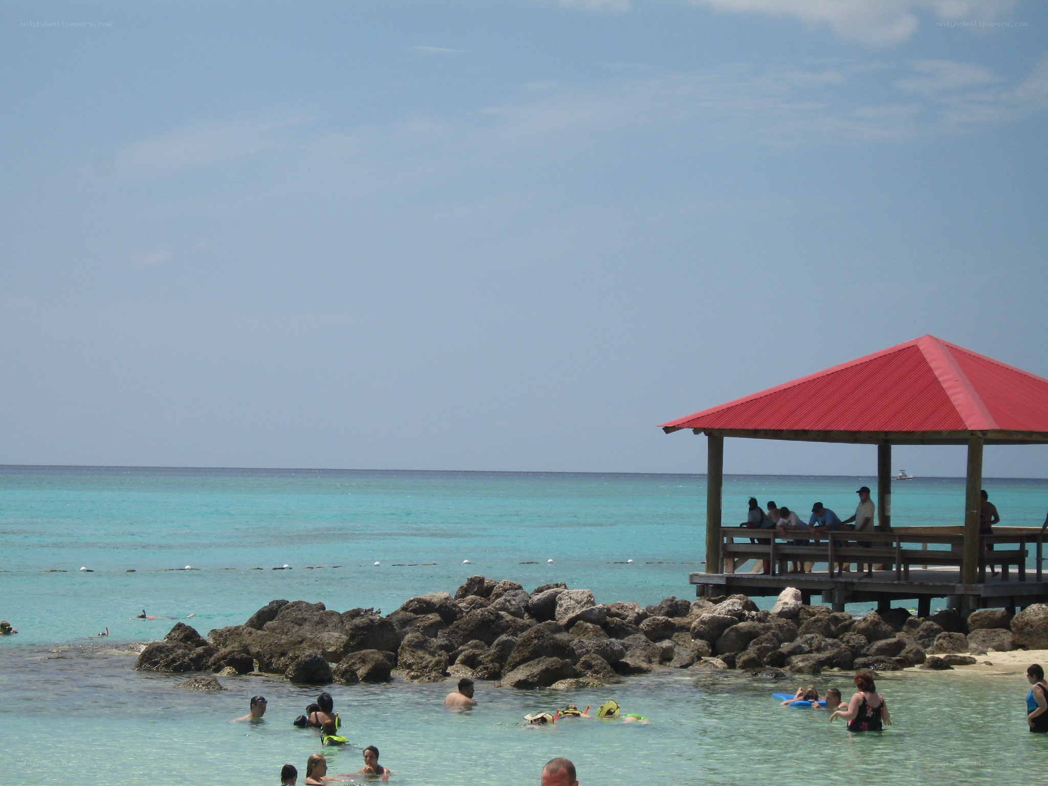 Beach with red-roofed gazebo