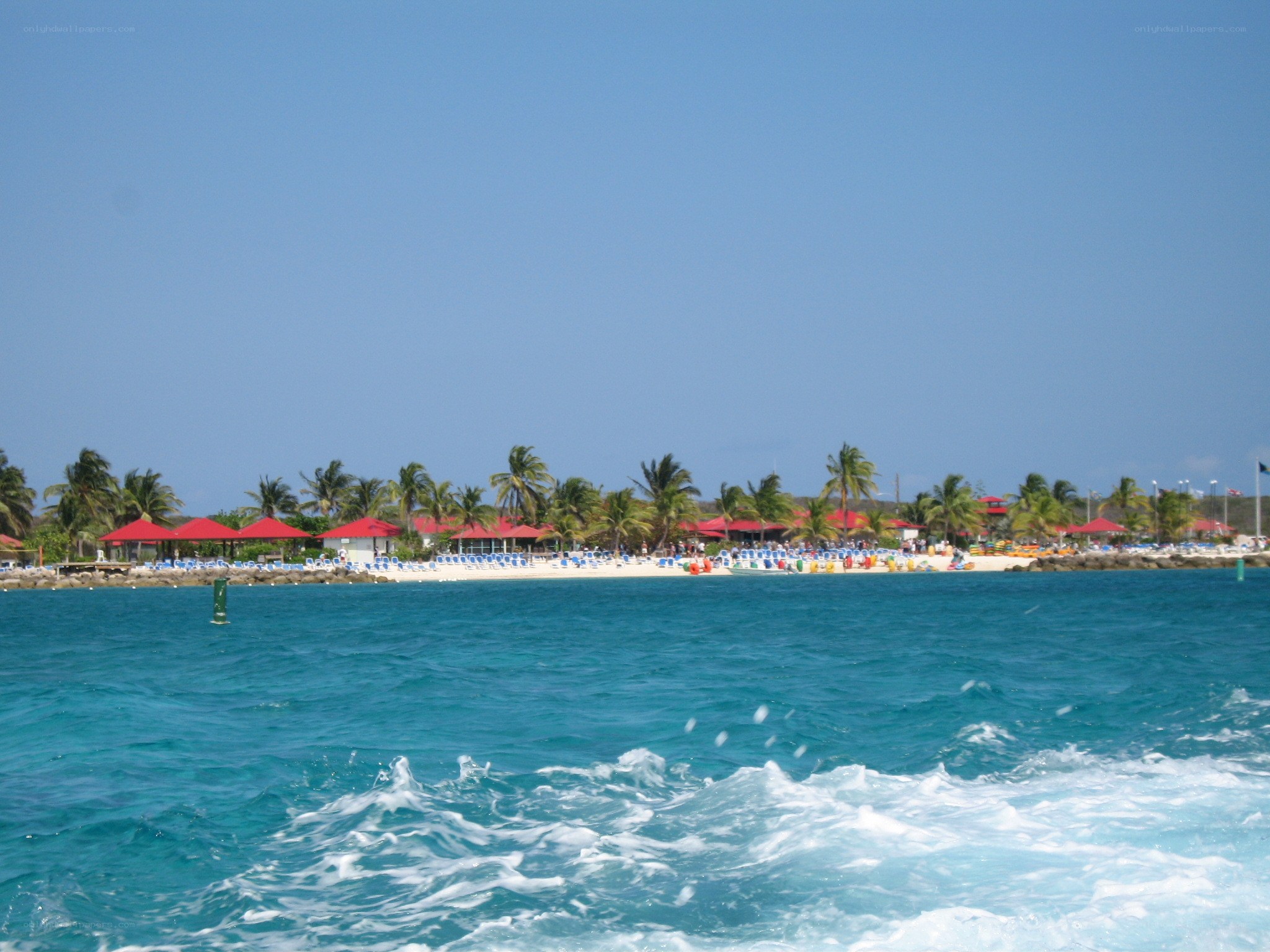 Beach with red umbrellas