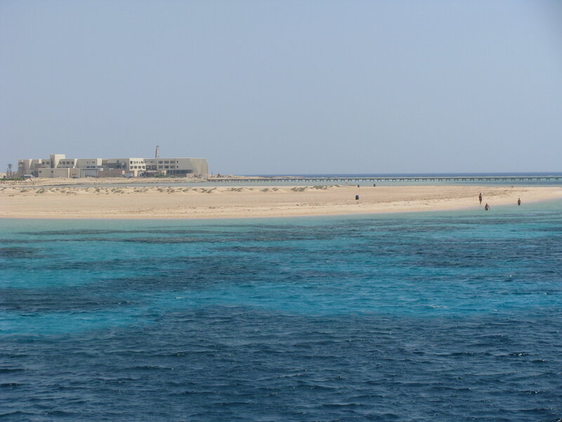Beach with resort in distance