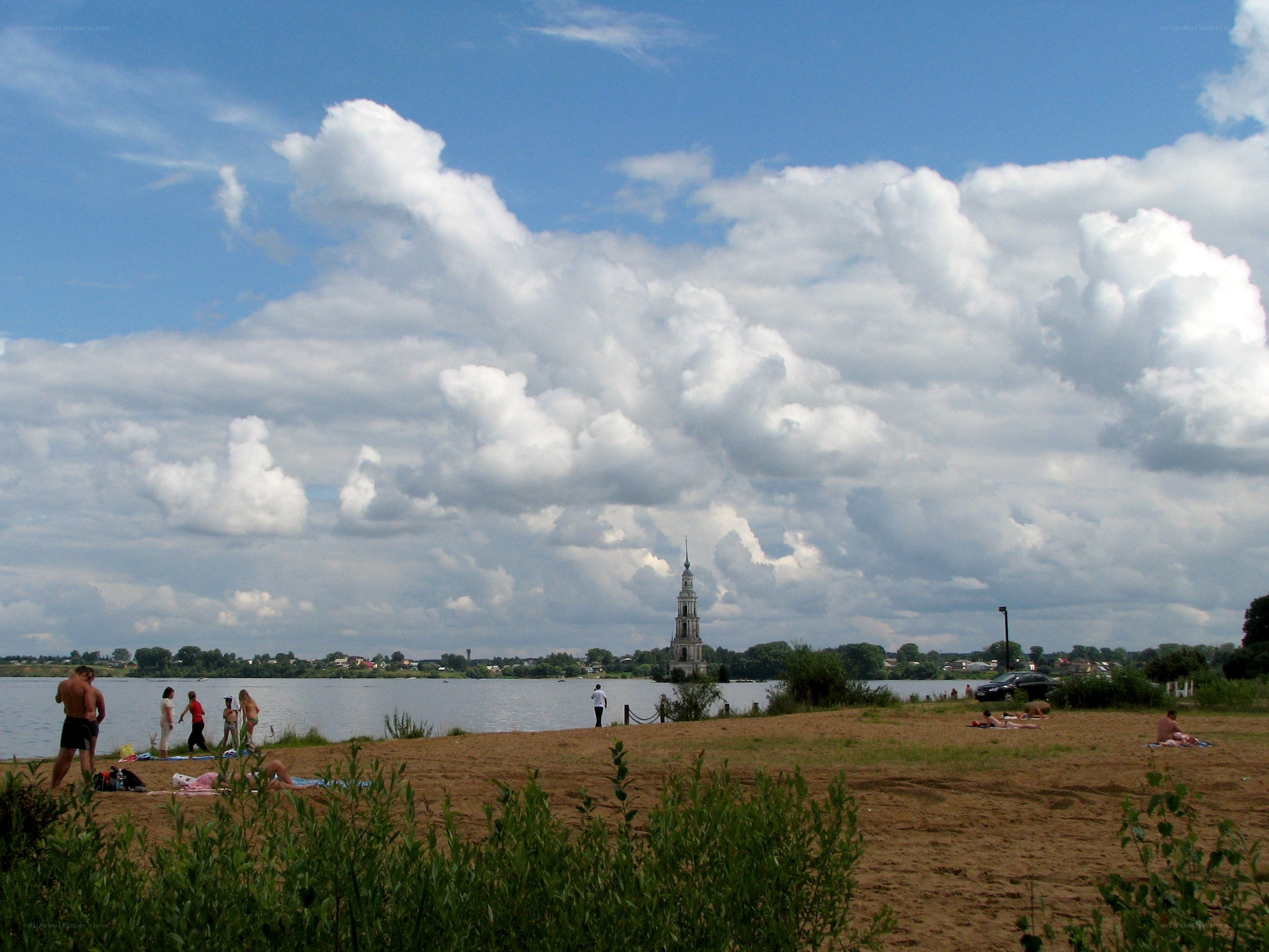 Beach with river and church tower