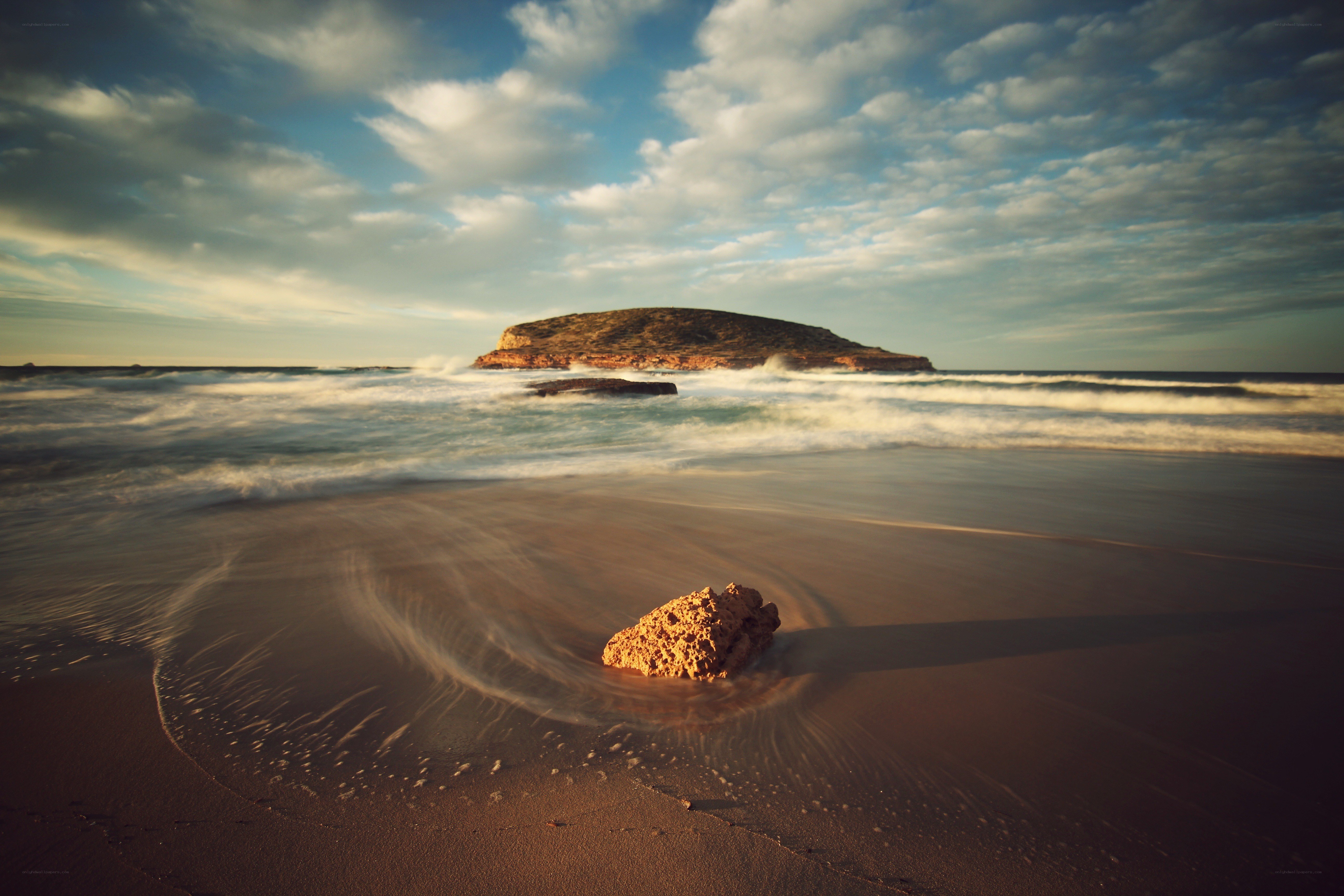 Beach with rock and island