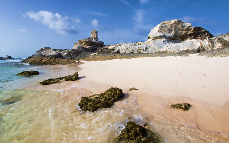 Beach with Rock Formations — Blue, Serene, Afternoon, Photograph