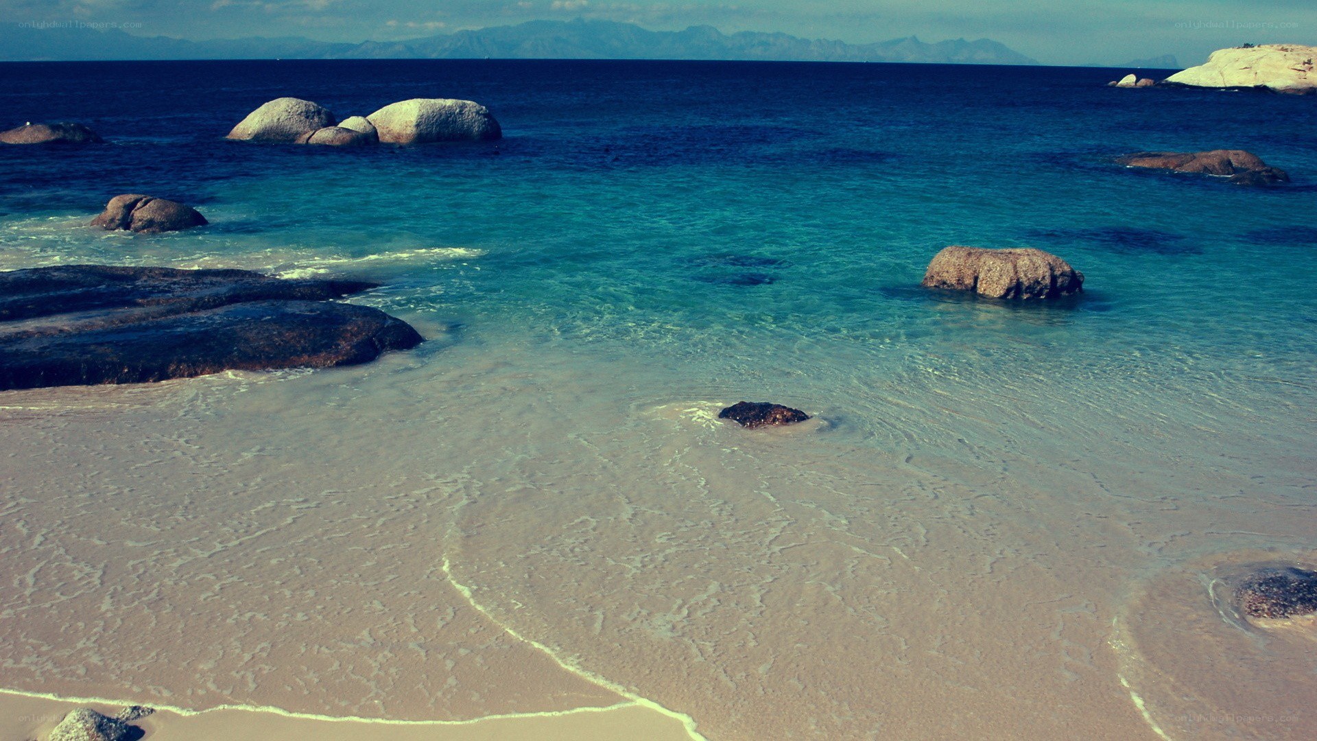beach with rocks and clear water