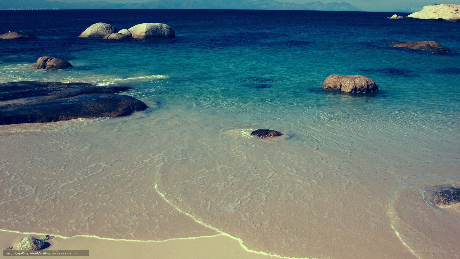 beach with rocks and clear water