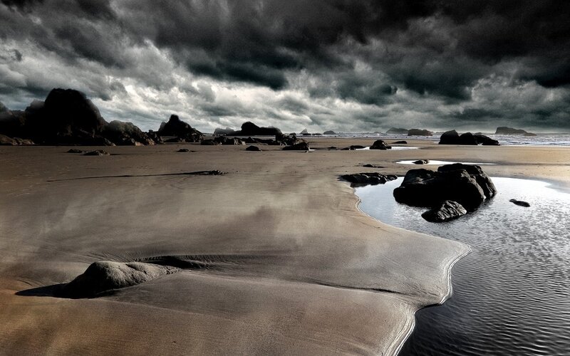 Beach with Rocks and Clouds