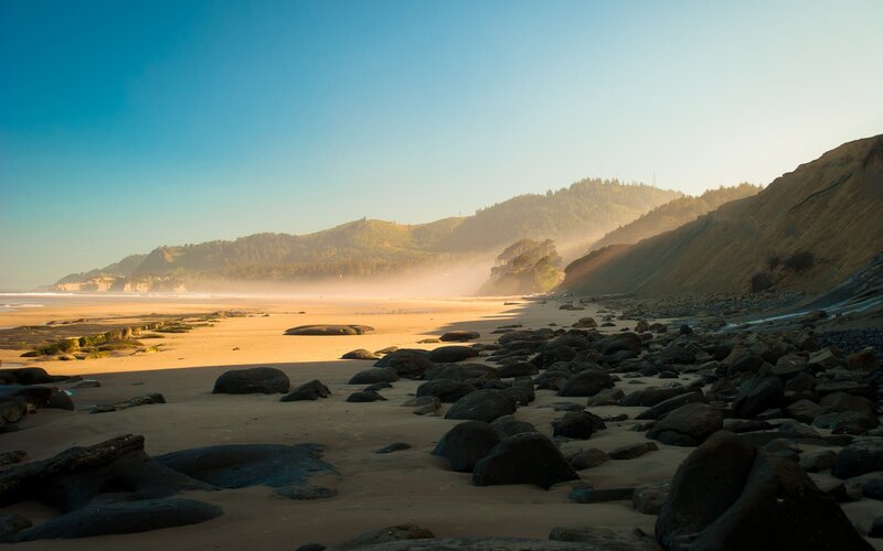 Beach with Rocks and Hills