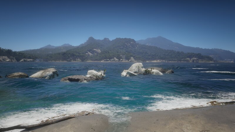 Beach with Rocks and Mountains — Blue