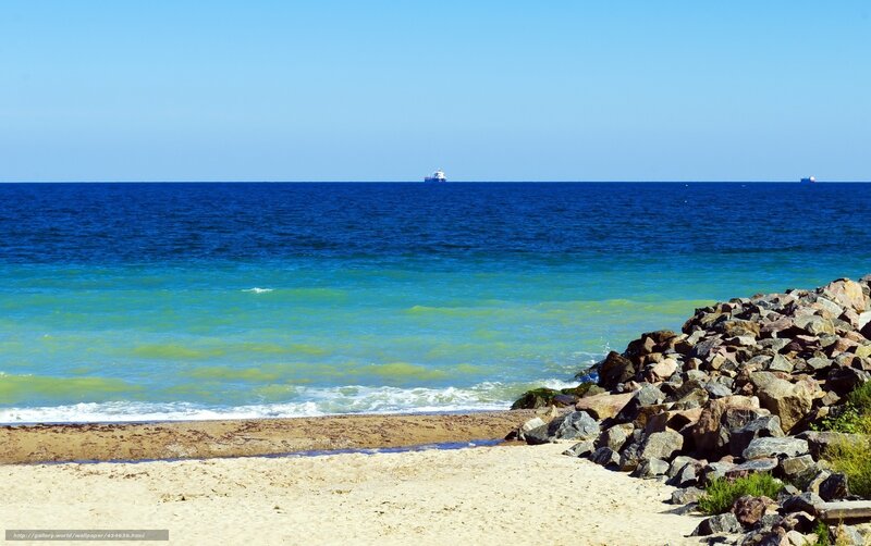 Beach with rocks and ship