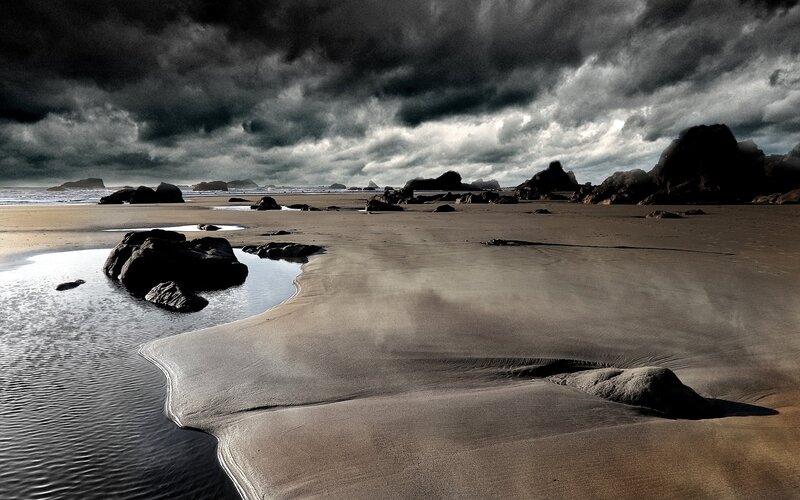 Beach with Rocks and Storm