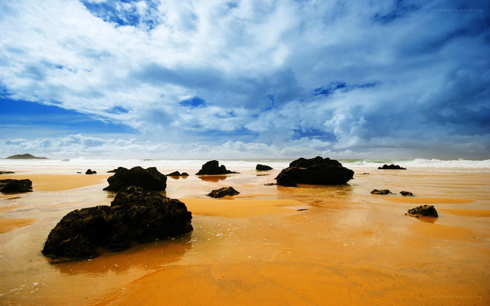 Beach with rocks and stormy sky
