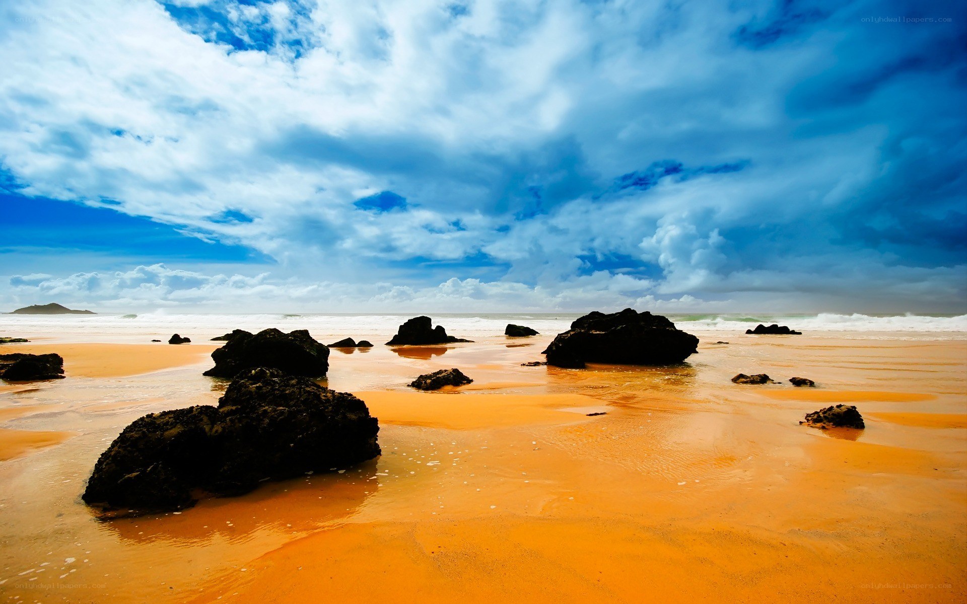 Beach with rocks and stormy sky