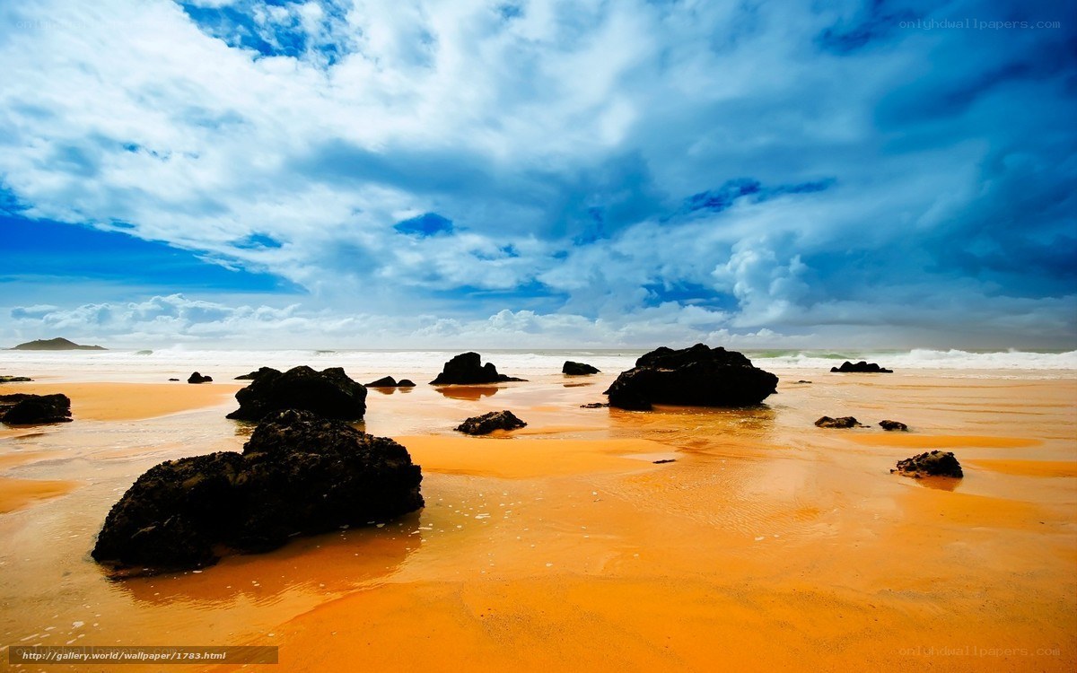 Beach with rocks and stormy sky