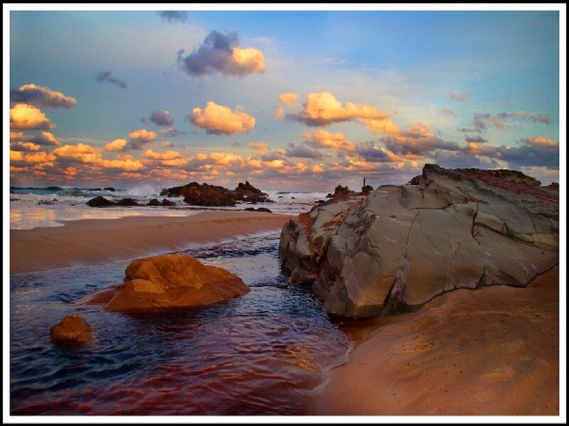 Beach with Rocks and Water