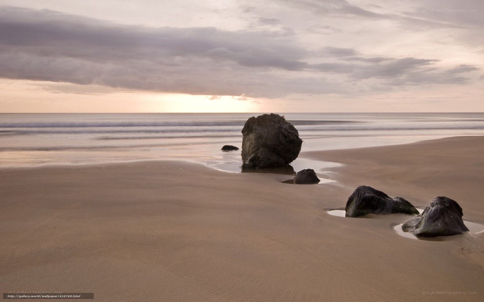 Beach with rocks at sunset